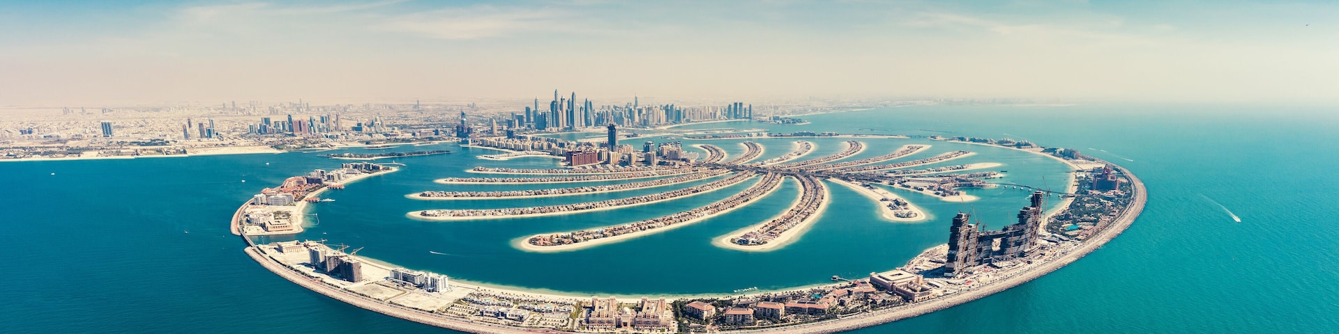 Aerial view on Palm Jumeira island in Dubai, UAE, on a summer day.