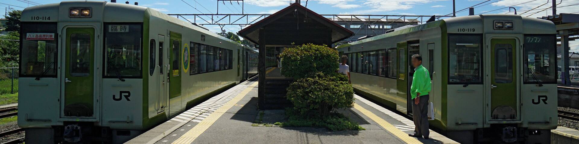 JR East KiHa 110 series DMUs on Koumi Line services at Kobuchizawa Station in Hokuto, [Yamanashi Prefecture, Japan