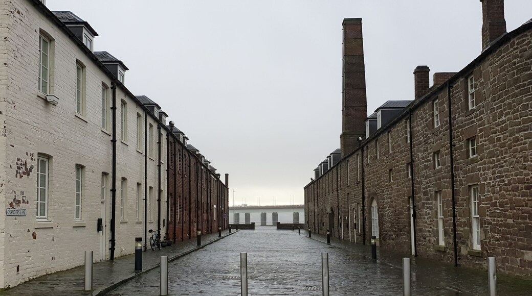 DUNDEE, UK, 18 FEBRUARY 2020 A photograph of Chandler's Lane, on the docks of Dundee on a grey, rainy day with the Tay Road Bridge in the background