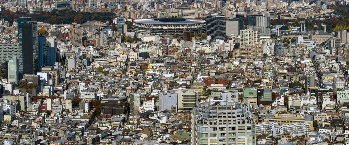 Expansive Tokyo cityscape featuring Japan National Stadium and surrounding Meiji Jingu Gaien area