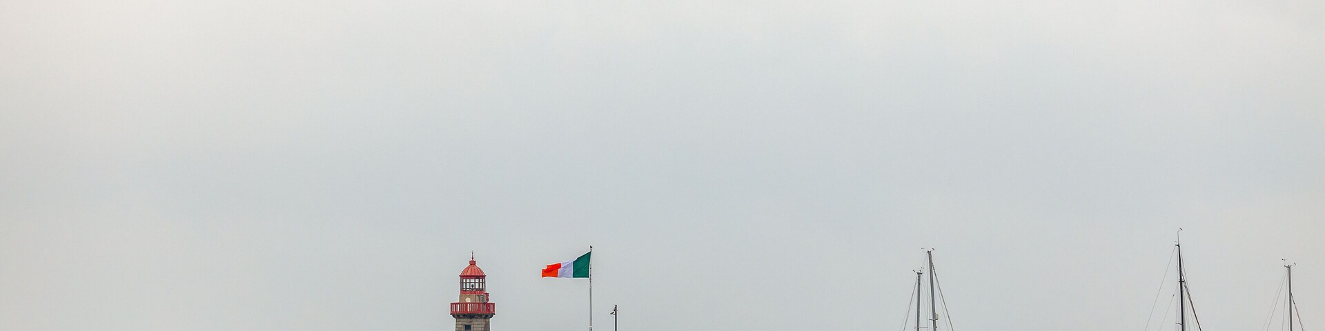 East Pier lighthouse in Dun Laoghaire harbor seen from East Pier, Dublin, Ireland