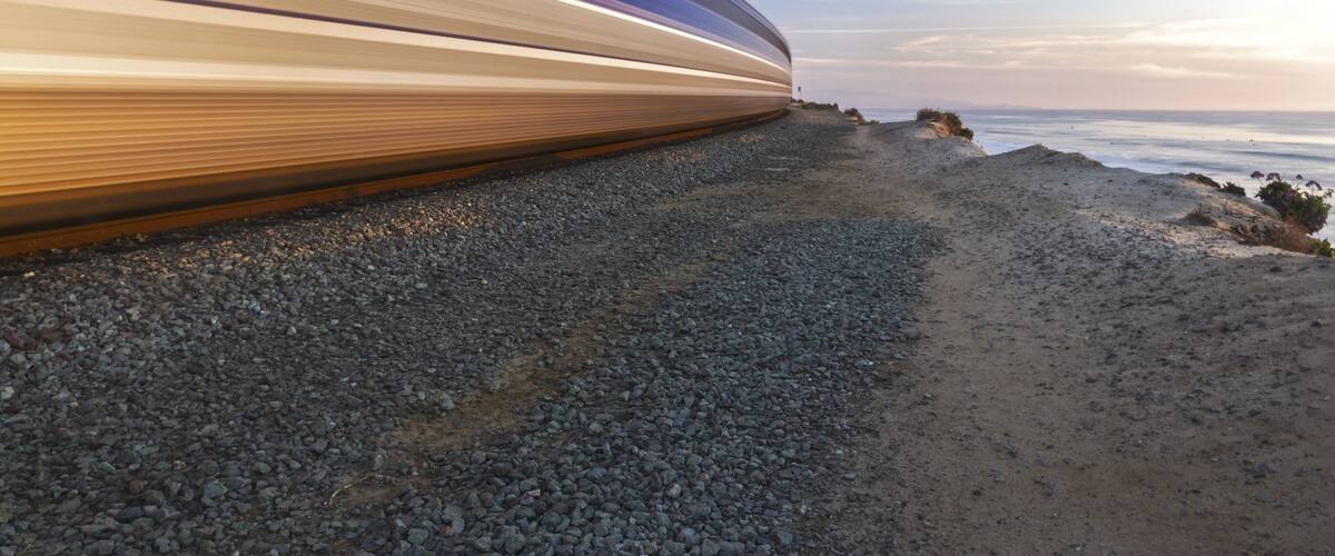 High Speed Coaster Train passing through Del Mar Heights along Pacific Coastline in San Diego County Southern California