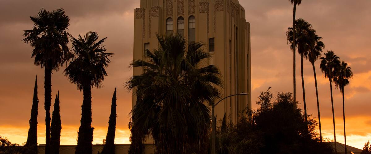 Sunset illuminates the historic art deco skyline of Van Nuys, California, USA.