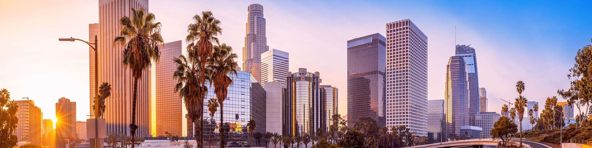 the skyline of los angeles during sunrise