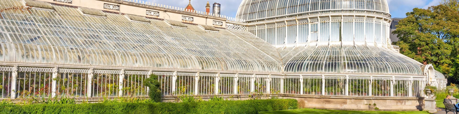 Exterior view of Palm House, a cast iron glasshouse designed in the 19th century by Charles Lanyon, in the Botanic Gardens near Ulster Museum, Belfast, Northern Ireland.