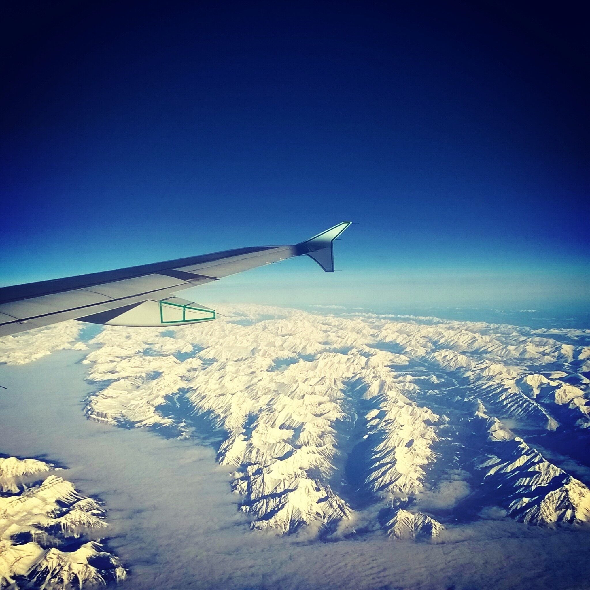 Flying over the Rocky Mountains en route to Vancouver. So happy we had clear skies to see the beautiful mountains! #snow