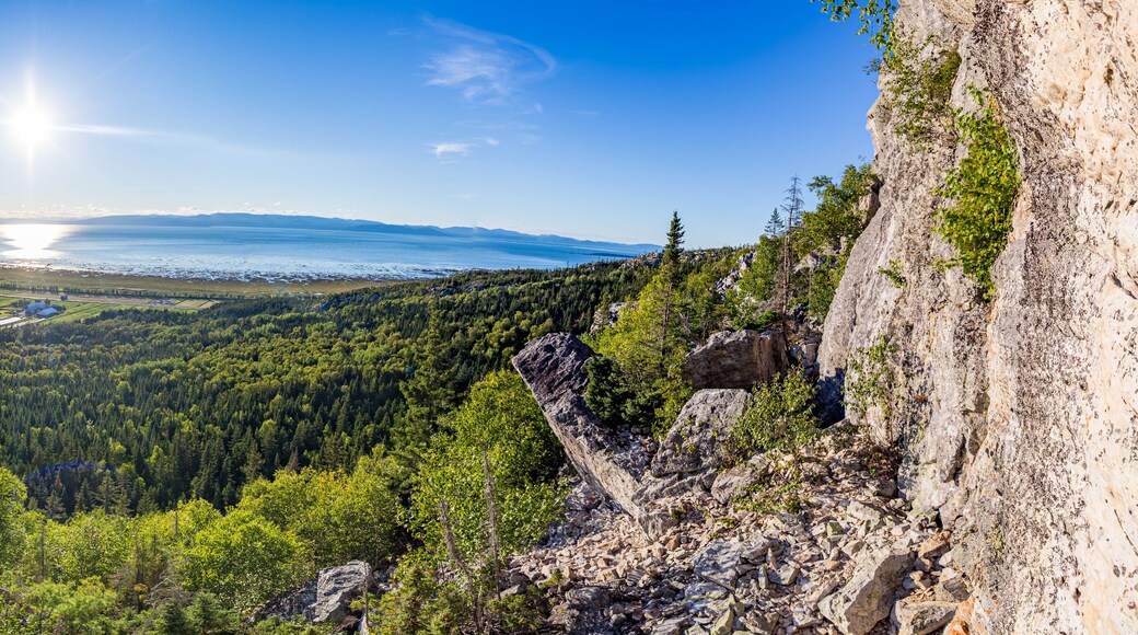 Rock Climber on Cliff with Panoramic View of St. Lawrence River, Kamouraska
