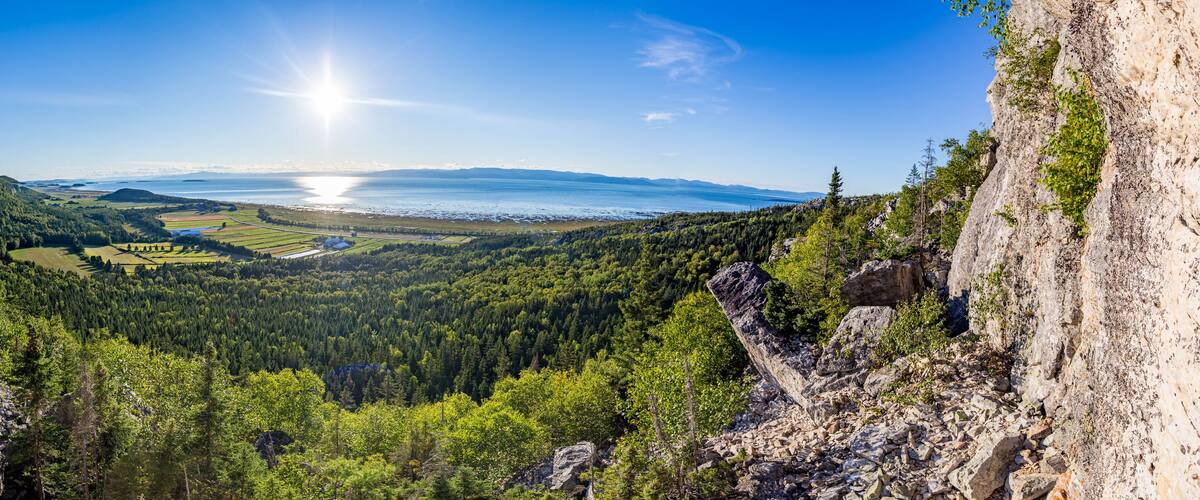 Rock Climber on Cliff with Panoramic View of St. Lawrence River, Kamouraska