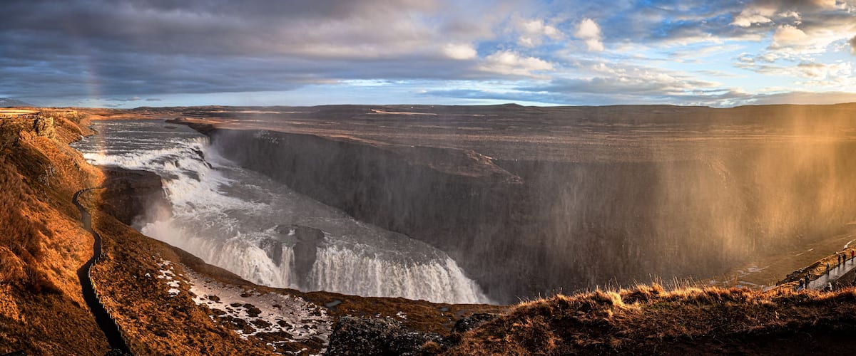 A large waterfall cascading down a steep cliff.