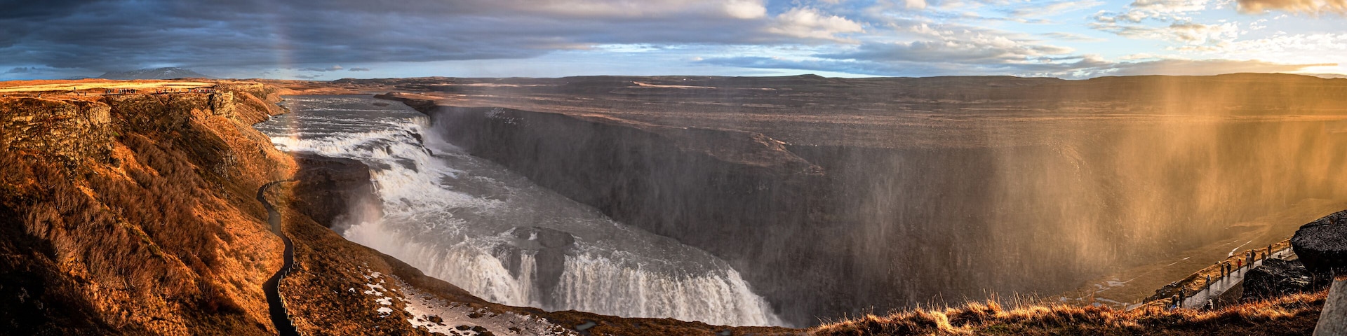 A large waterfall cascading down a steep cliff.