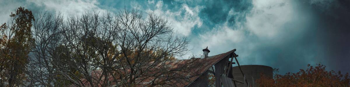 Cold air landscapes of rural scenes depicting barns and abandoned homes in fall colour settings around the South East of Ontario Canada in The Greater Napanee and Stone Mills township.