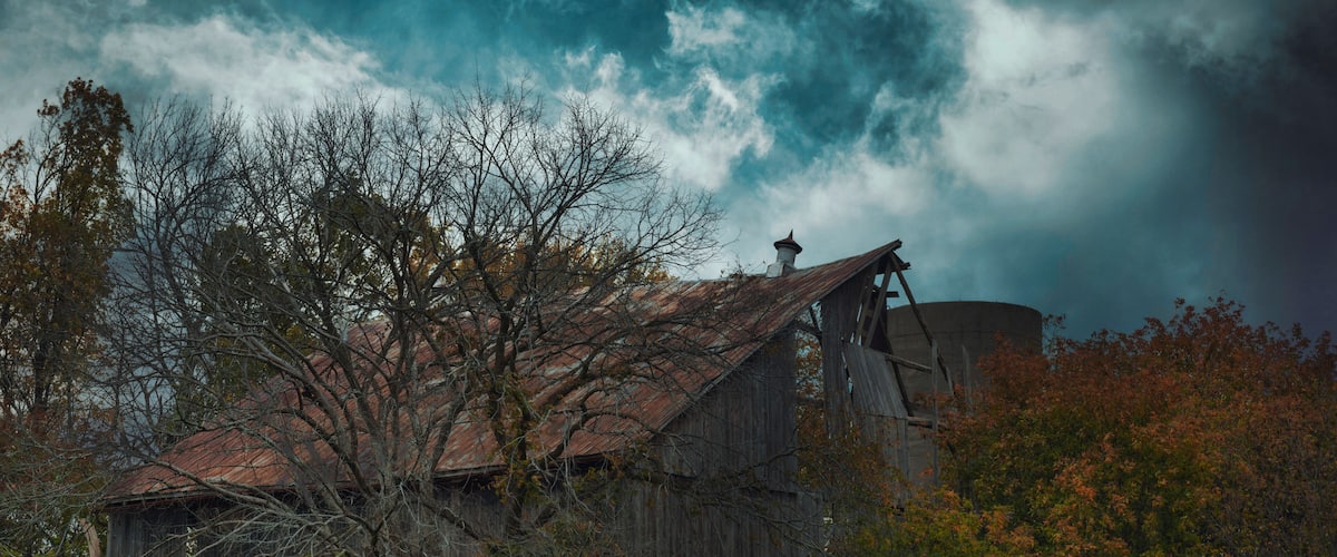 Cold air landscapes of rural scenes depicting barns and abandoned homes in fall colour settings around the South East of Ontario Canada in The Greater Napanee and Stone Mills township.