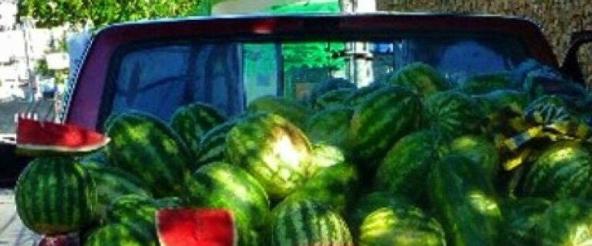 A truck loaded with watermelons.
