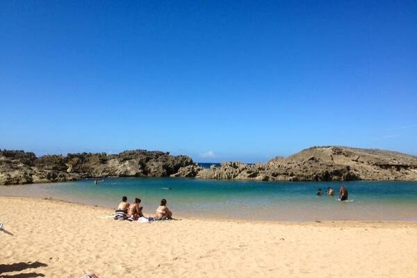 Playa Vega Baja, also known as Playa Puerto Nuevo and La Playa Sucia is a serene little beach sheltered from the windy North Atlantic swells by a quarter mile long natural rock wall. The waters are calm, clear, and shallow, perfect for snorkeling, swimming, and playing. There are some natural pools that form when sea water overtops the rock walls and provide a natural alternative for those afraid of the open waters. This is one of the best calm beaches within an hour of San Juan, and a favorite of locals. Thereâs plenty of parking and lots of vendors selling food, drink, and beach gear to visitors.
#puertorico