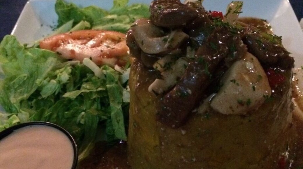 Nice place to eat, rustic look, open setting, good price! This plate was Mofongo (Mash plantain) with Churrasco & Chicken on Mushroom sauce!