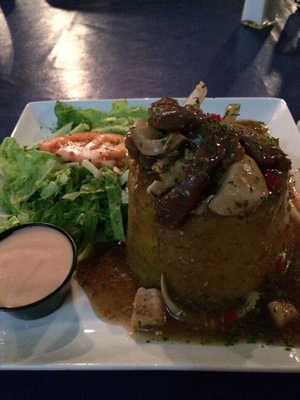 Nice place to eat, rustic look, open setting, good price! This plate was Mofongo (Mash plantain) with Churrasco & Chicken on Mushroom sauce!