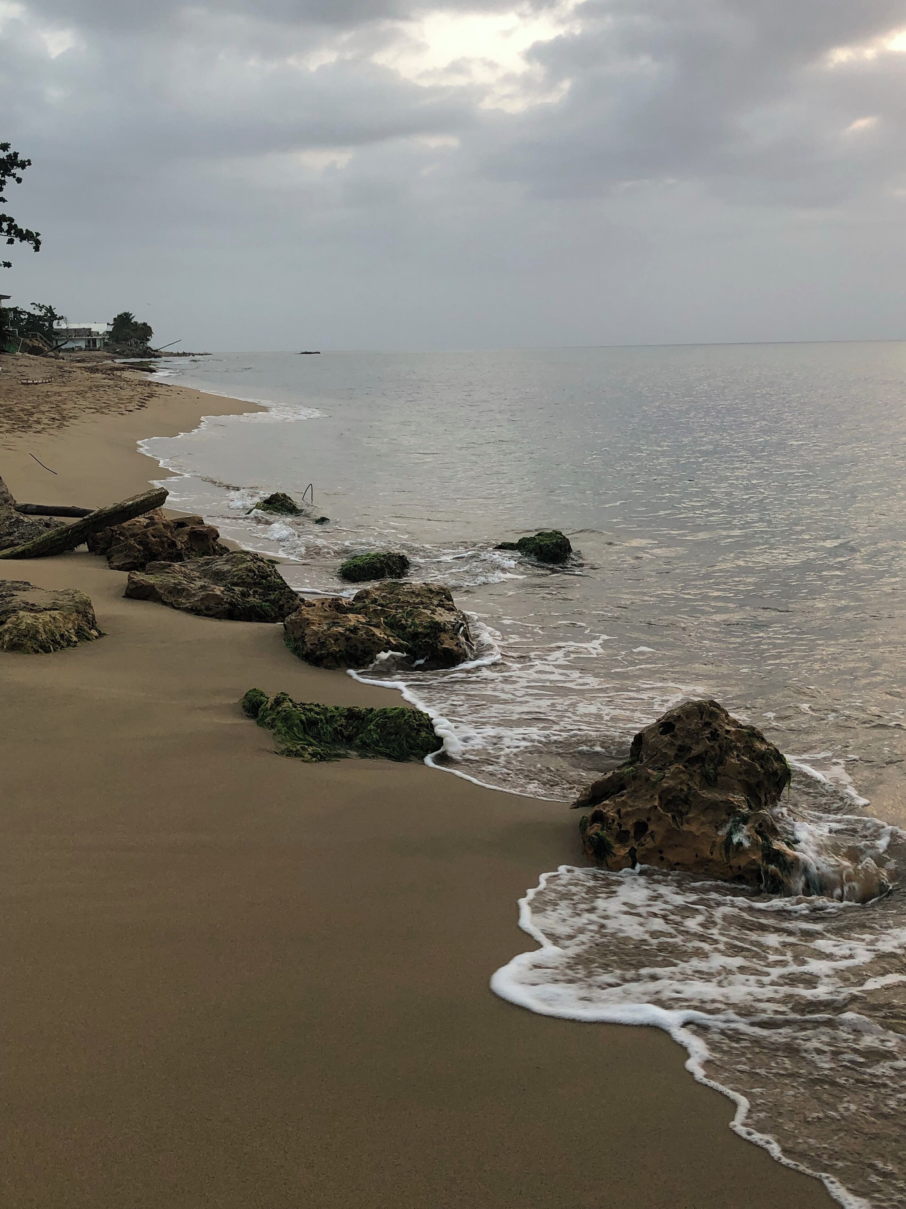 A beach with rocks and waves.