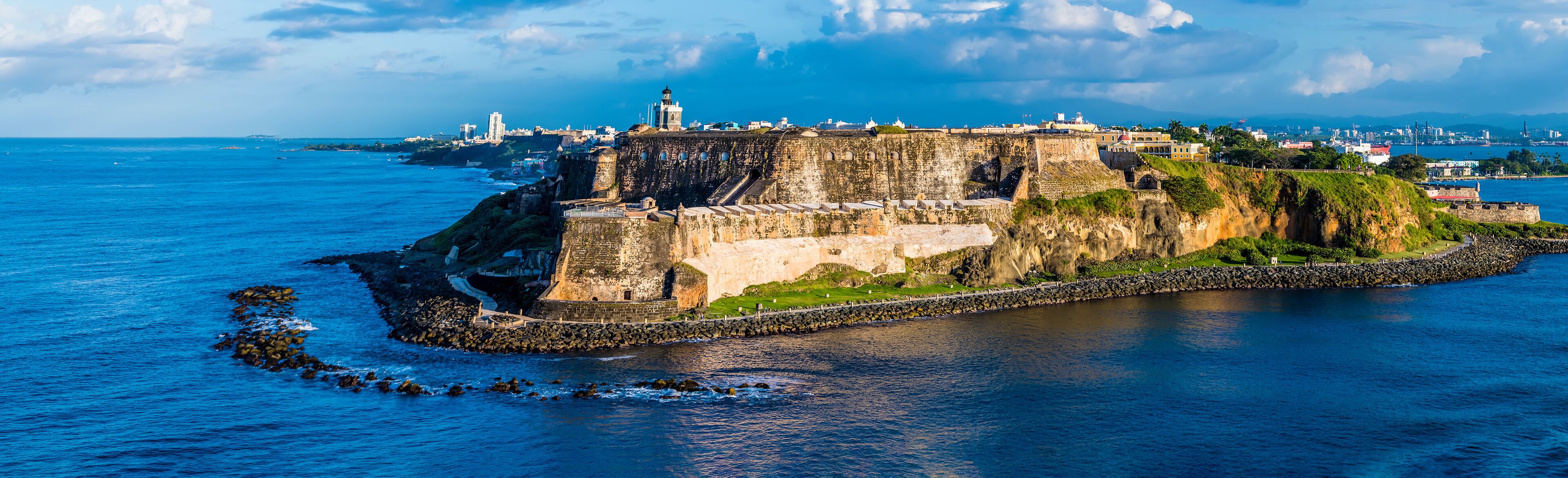 A panorama view of the fortifications approaching the harbour entrance in San Juan, Puerto Rico on a bright sunny day