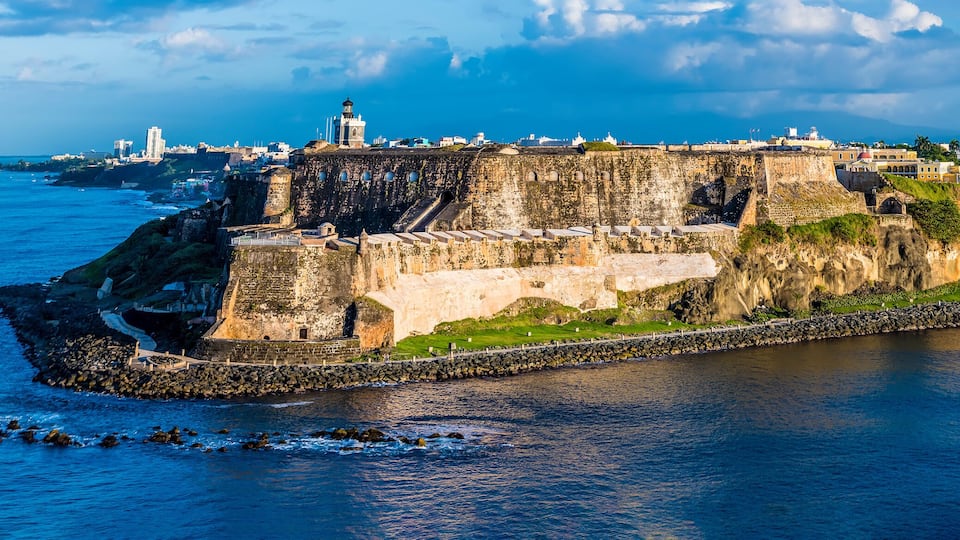 A panorama view of the fortifications approaching the harbour entrance in San Juan, Puerto Rico on a bright sunny day