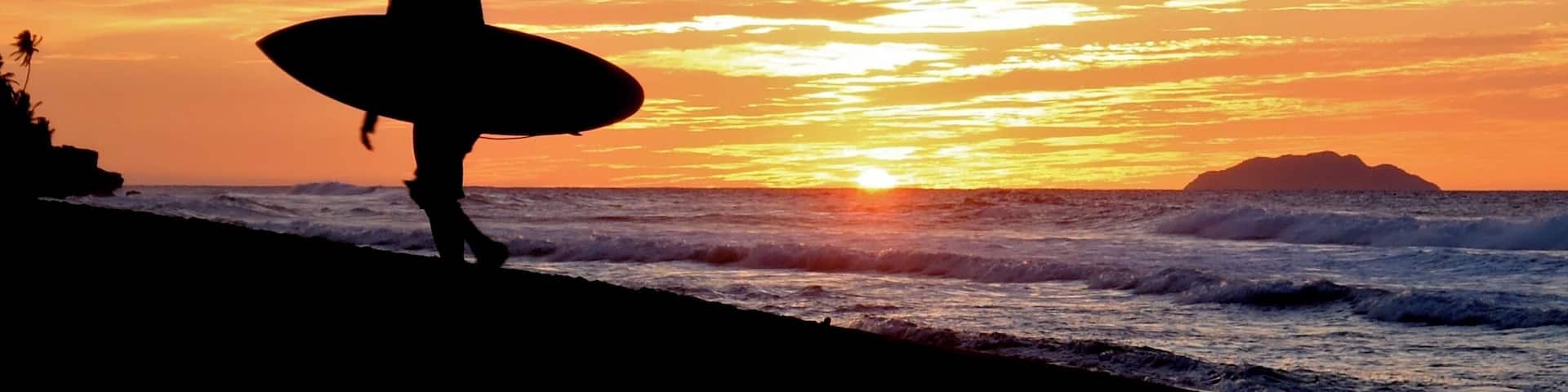 Sandy beach is usually uncrowded and has plenty of sand to stretch out on and catch the rays. There are also numerous surf breaks located up and down the beach. There are a few bars and restaurants to satisfy your thirst and hunger. You can rent watersports equipment at the parking lot. Just a great family beach.