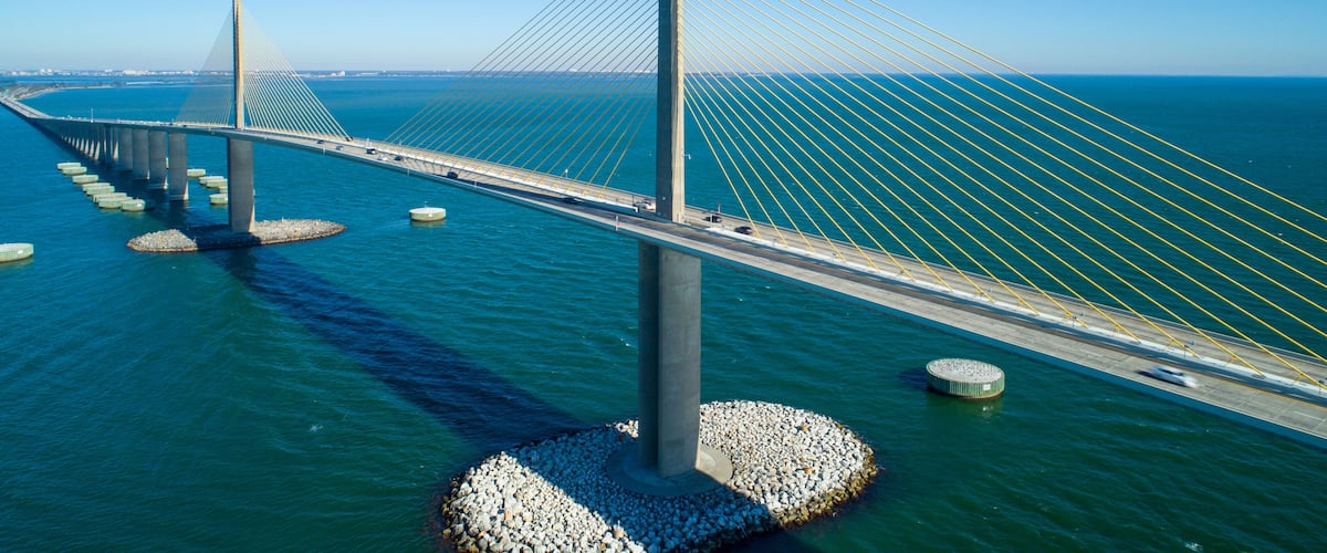 A cable-stayed bridge over water with multiple towers and cables.