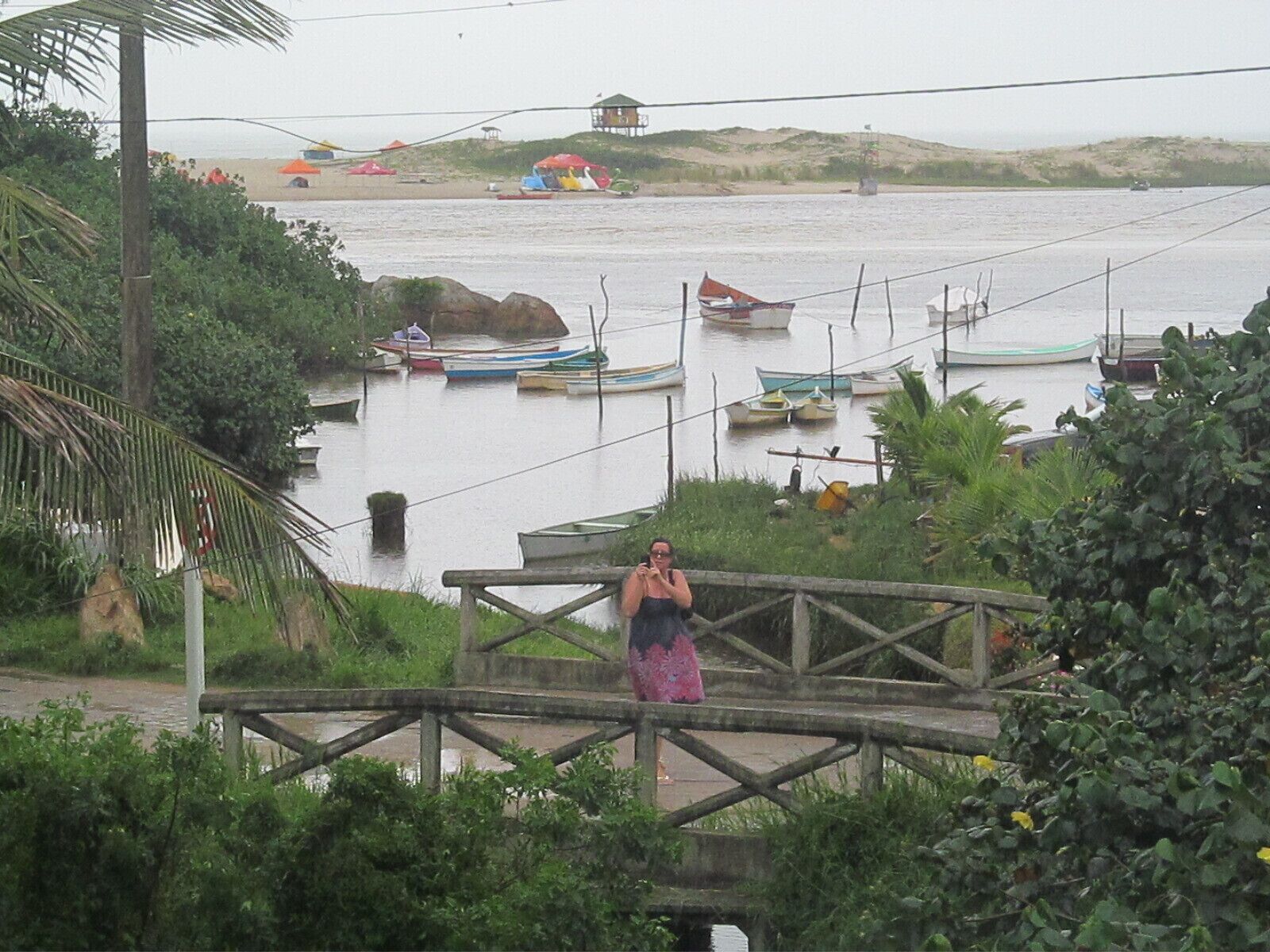 Great view from our apartment, these boats take people to the beach, it is a kind of river, other people cross it swimming.