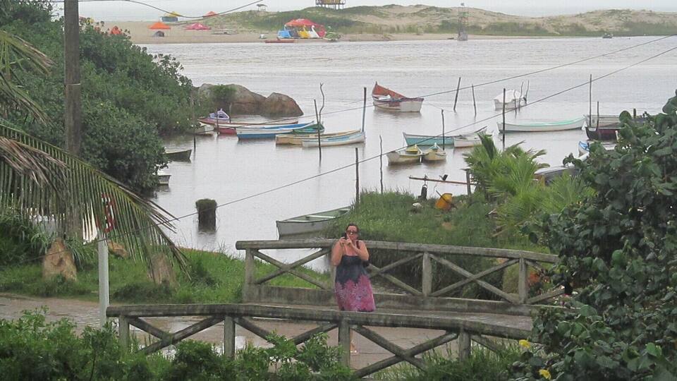 Great view from our apartment, these boats take people to the beach, it is a kind of river, other people cross it swimming.