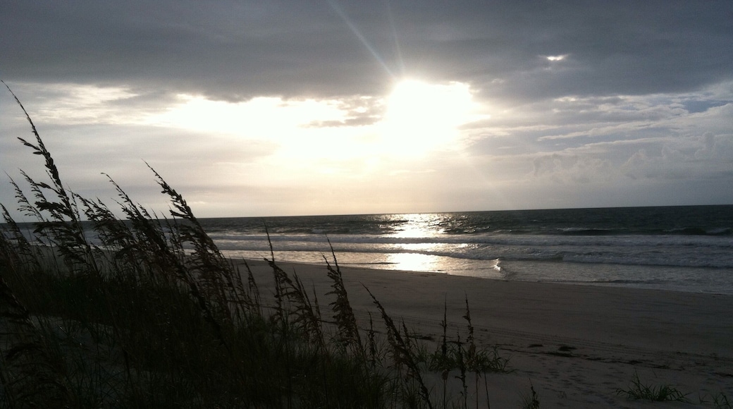 sunrise through the clouds at figure eight island north carolina
