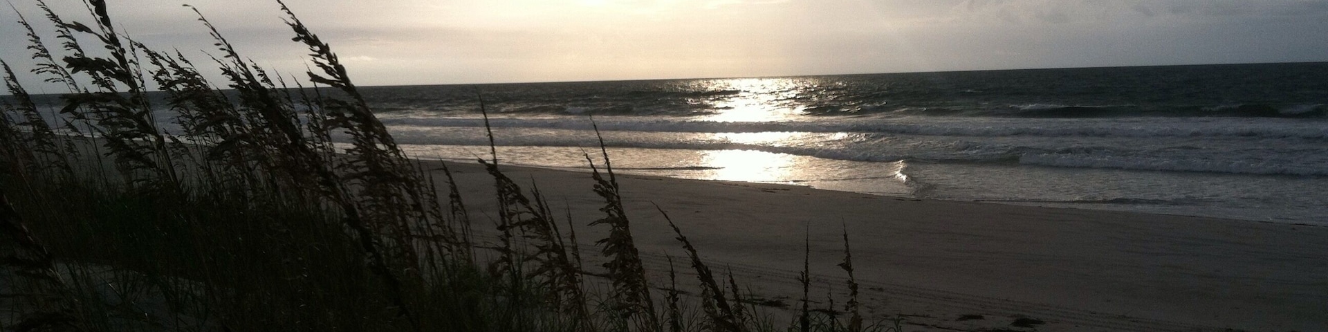 sunrise through the clouds at figure eight island north carolina