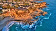 Aerial view of Three Arch Bay in Laguna Beach, Orange County, California during twilight