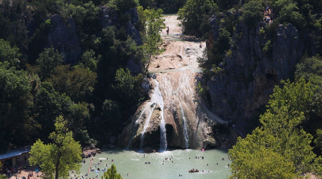 Medium wide aerial shot of Turner Falls .Arbuckle Mountains in Oklahoma.