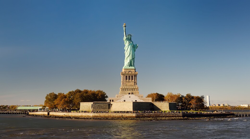 Panorama of island of Liberty with statue of Liberty seen from the ferry in the Hudson river.