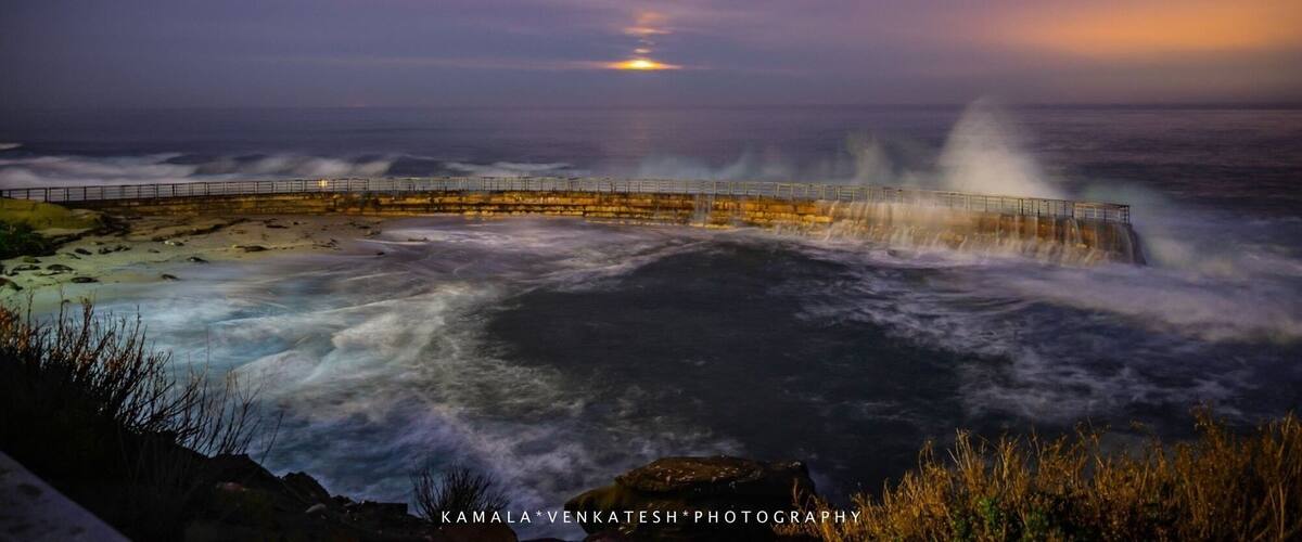 Full ‘pink’ moon shrouded in clouds sets over the Pacific Ocean one pre-dawn spring morning near San Diego highlighting the stone and metal curved wall that protects a part of beach from the severe waves for young beach goers. Hence the name ‘Children’s Pool Beach’!
#nature contest