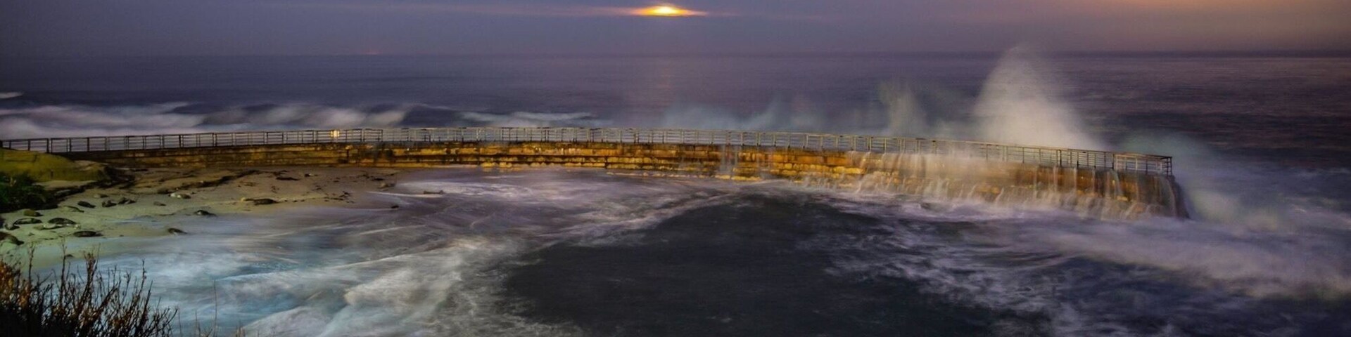 Full ‘pink’ moon shrouded in clouds sets over the Pacific Ocean one pre-dawn spring morning near San Diego highlighting the stone and metal curved wall that protects a part of beach from the severe waves for young beach goers. Hence the name ‘Children’s Pool Beach’!
#nature contest