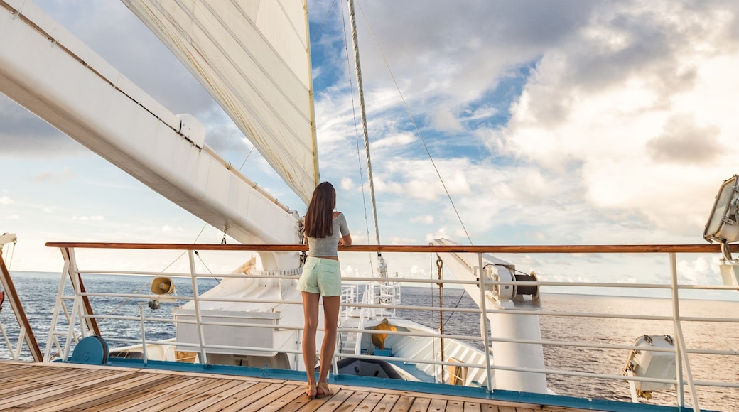 Luxury cruise ship vacation woman on deck banner panorama. Travel in Tahiti on sail boat, exotic destination. Tourism in oceania. Boat sailing away on tropical getaway, Shutterstock ID 1112331056, Pur