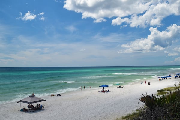 500px Photo ID: 170153661 - Bright sun, blue skies, a few clouds, and green water.