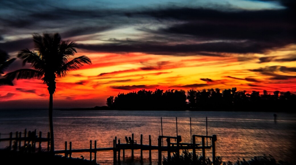 sunset over the bay, water, sky, red, intense, swirls, clouds, landscape, island, horizon, tropical, Siesta Key, Florida