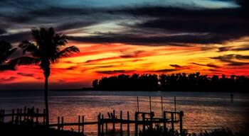 sunset over the bay, water, sky, red, intense, swirls, clouds, landscape, island, horizon, tropical, Siesta Key, Florida