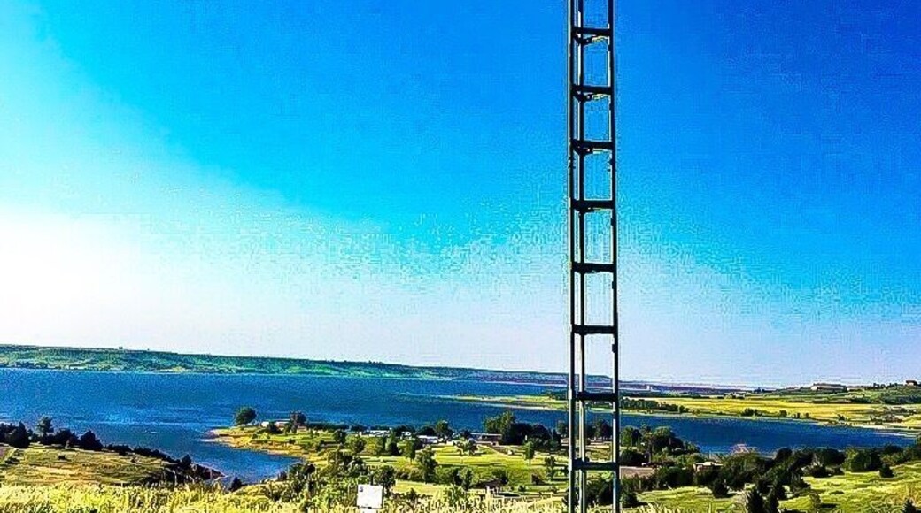 Zane hanging on an pole at switchgrass trails at Wilson lake