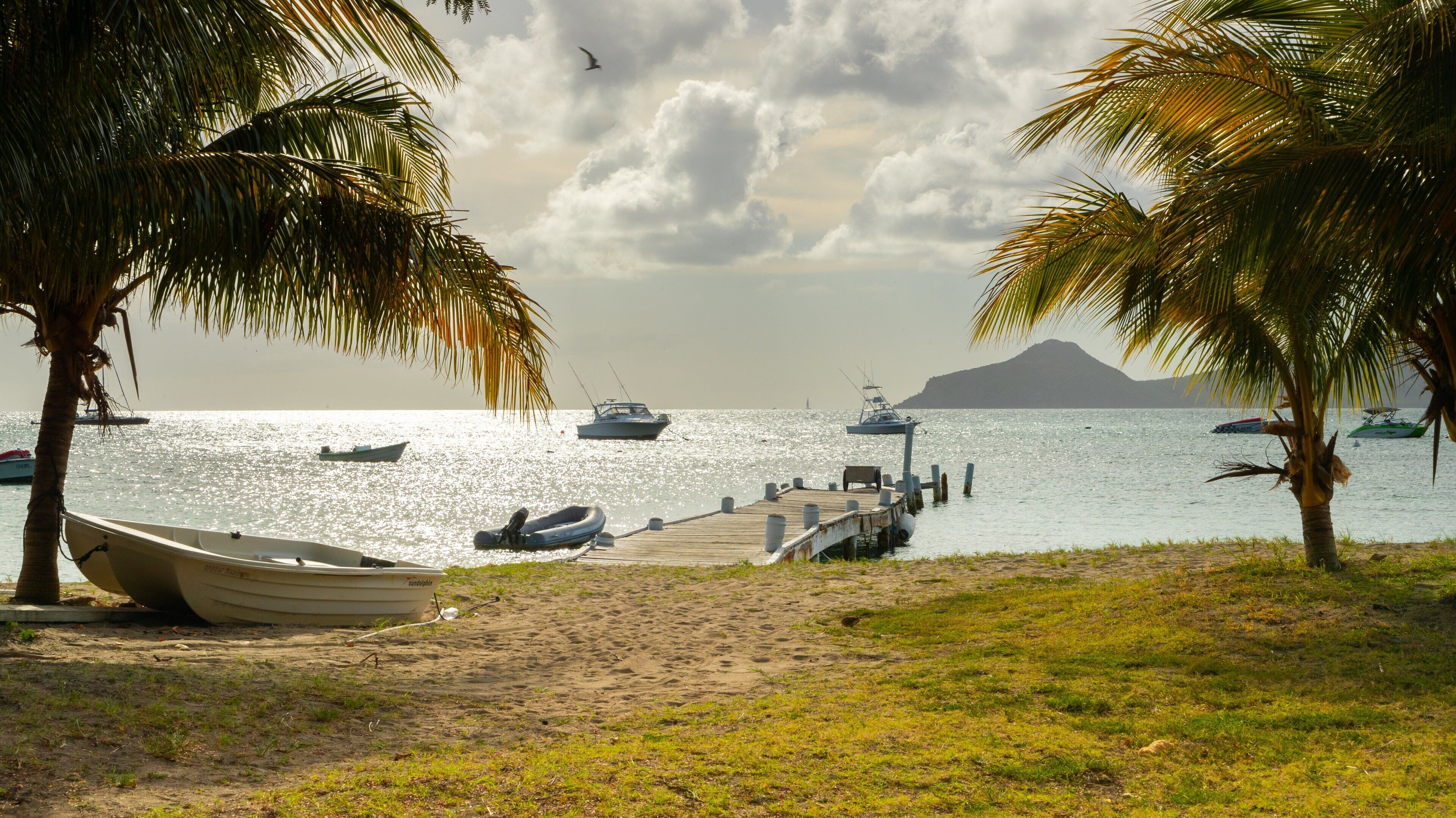 Oualie Beach which includes a bay or harbor, general coastal views and tropical scenes