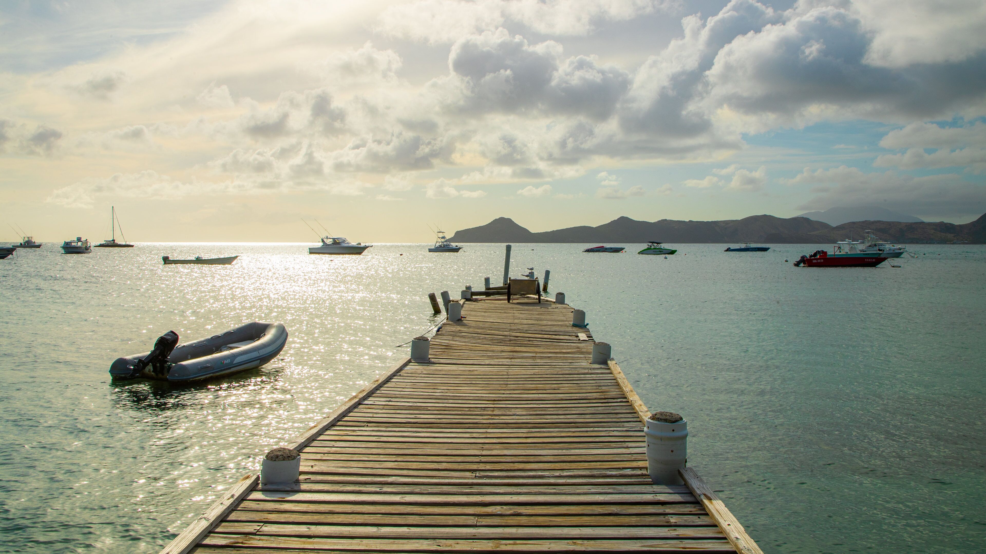 Oualie Beach showing a sunset and a bay or harbor