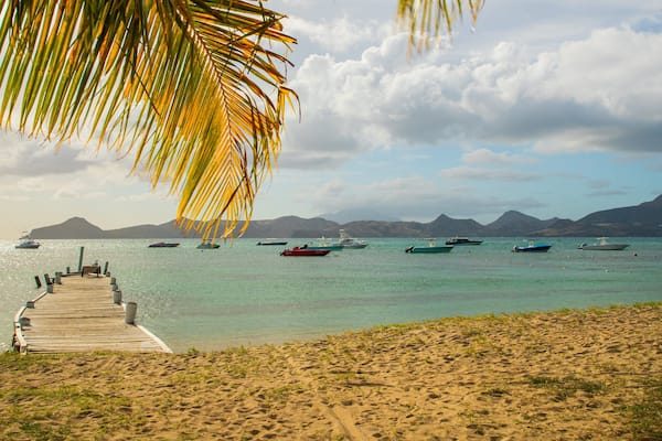 Oualie Beach which includes a sandy beach, tropical scenes and general coastal views