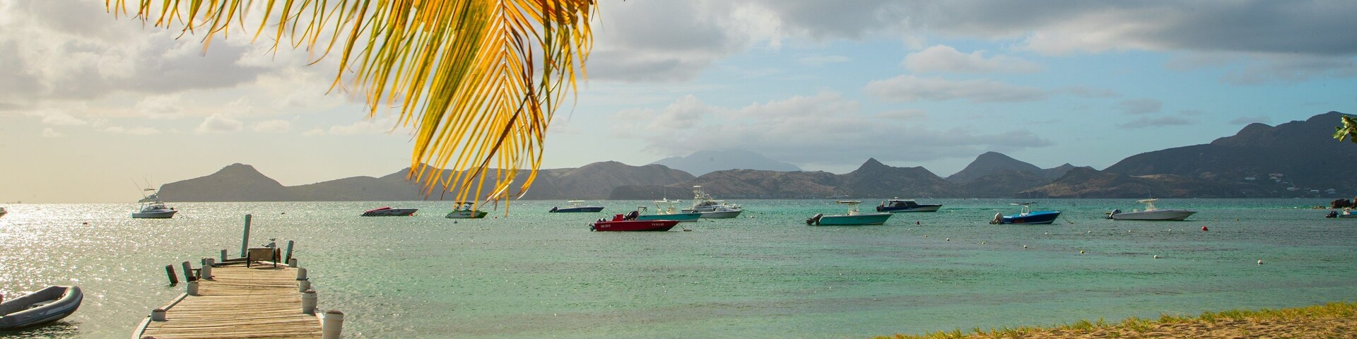 Oualie Beach which includes a sandy beach, tropical scenes and general coastal views