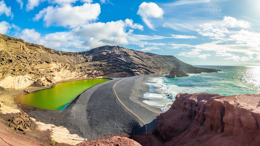 Landscape with unique Lago Verde and black sands at El Golfo beach, Lanzarote, Canary islands, Spain
