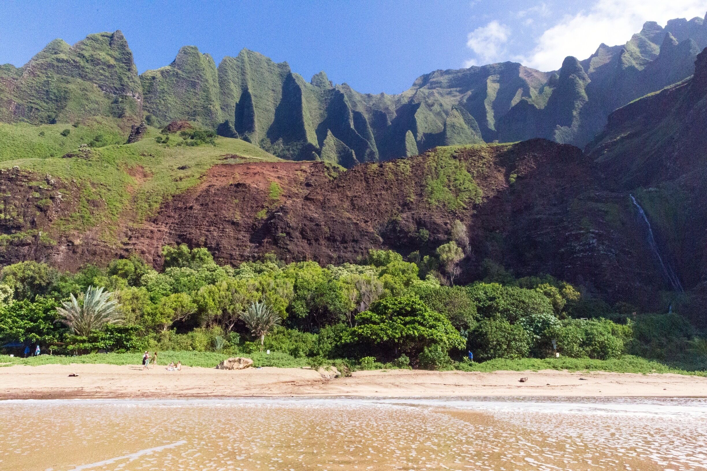 Kalalau Beach is a beautiful, secluded beach at the end of an 11 mile trail. The only access is by foot or kayak (in Summer). A permit is required for camping. One of the best hikes I’ve ever done. The permit can be made for up to 5 nights. I recommend staying at least 3 nights, to explore the valley. 
#BeachTips