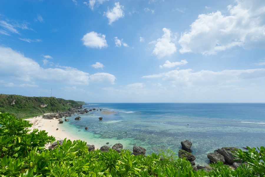 Tropical beach paradise full of clear turquoise water and healthy coral reef by perfect white sand beach in Miyako-jima, Okinawa, Japan; Shutterstock ID 248734339