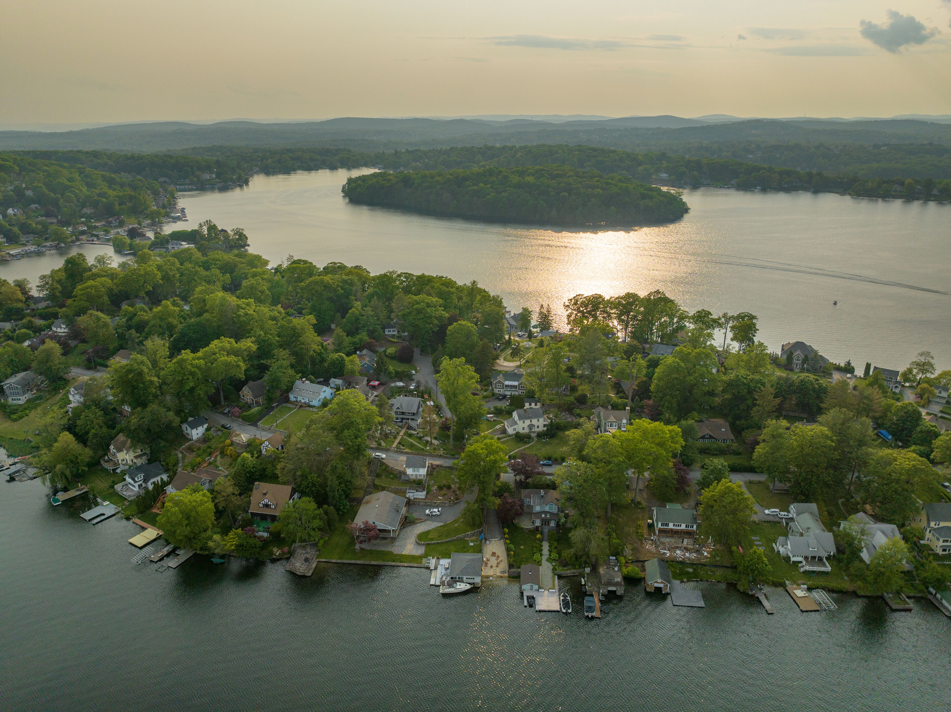 Late afternoon aerial photo of Lake Mahopac located in Town of Carmel, Putnam County, New York.