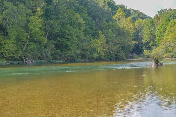 The Current River flows through the Ozark National Scenic Riverway through the mountains of Missouri