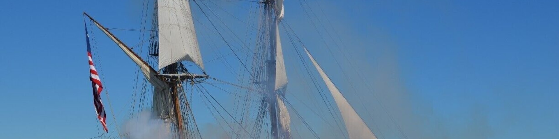 A rare shot of the Tall Ship Niagara shrouded in smoke during its cannon breach amidst the Battle of Lake Erie Bicentennial battle reenactment. #TroveOn