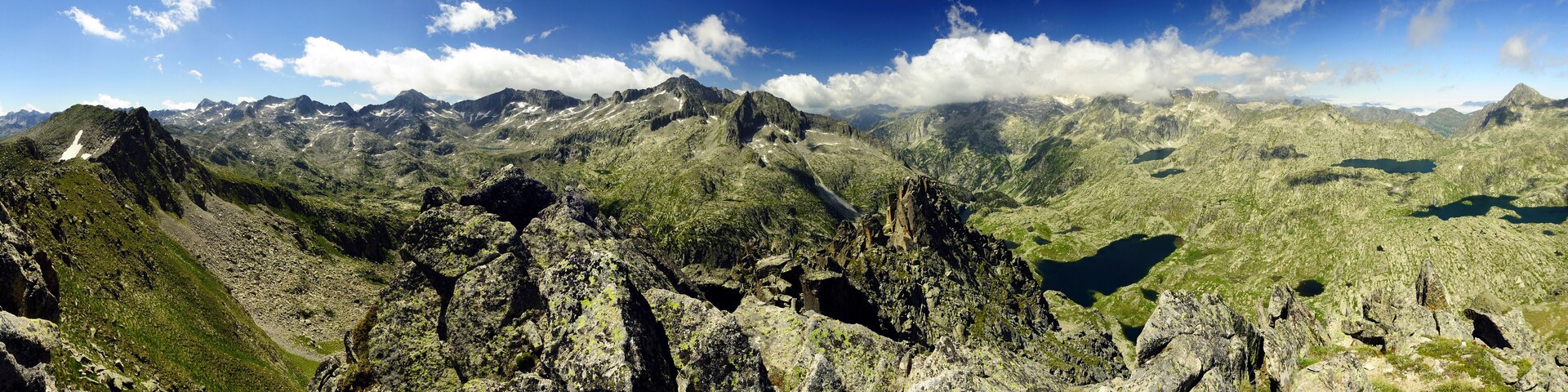 Panoramic view of mountains seen from the Pic de Travessani summit (BoĂ Valley, Catalonia, Spain, Pyrenees)